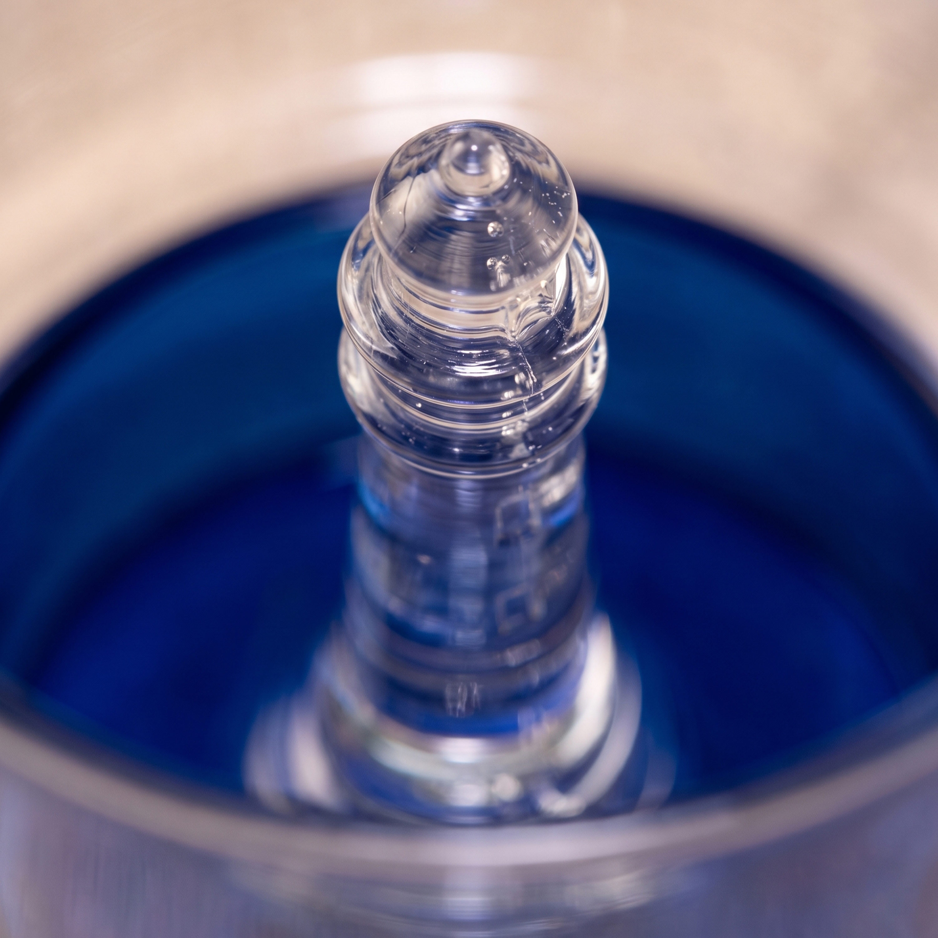 Close-up of the lighthouse at the base of the glass